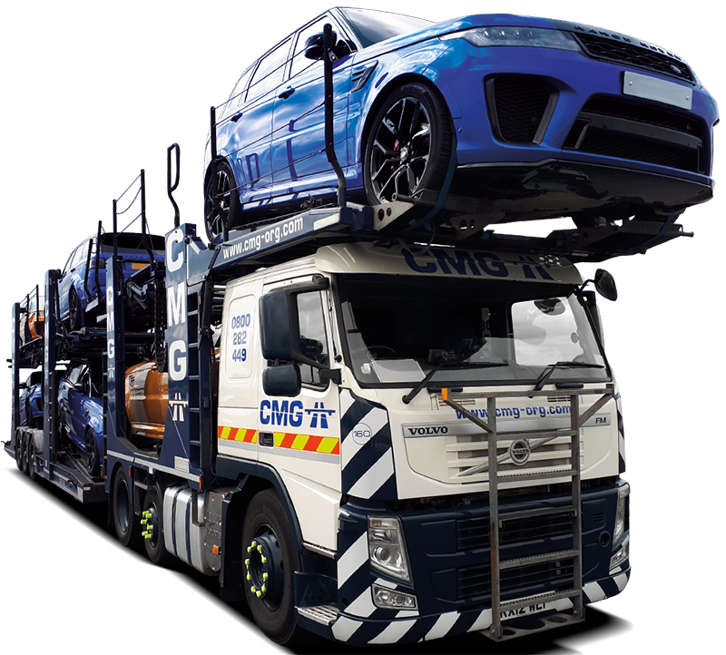 a volvo truck is carrying a range rover on top of it