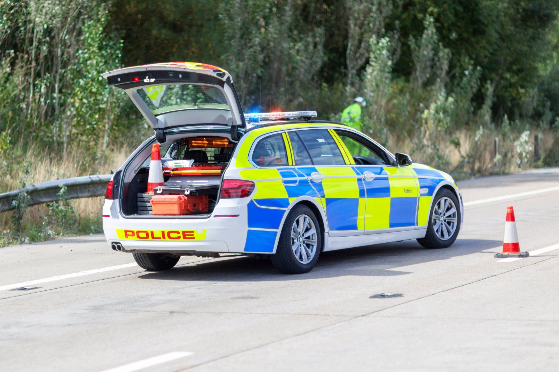 a police car is parked on the side of the road
