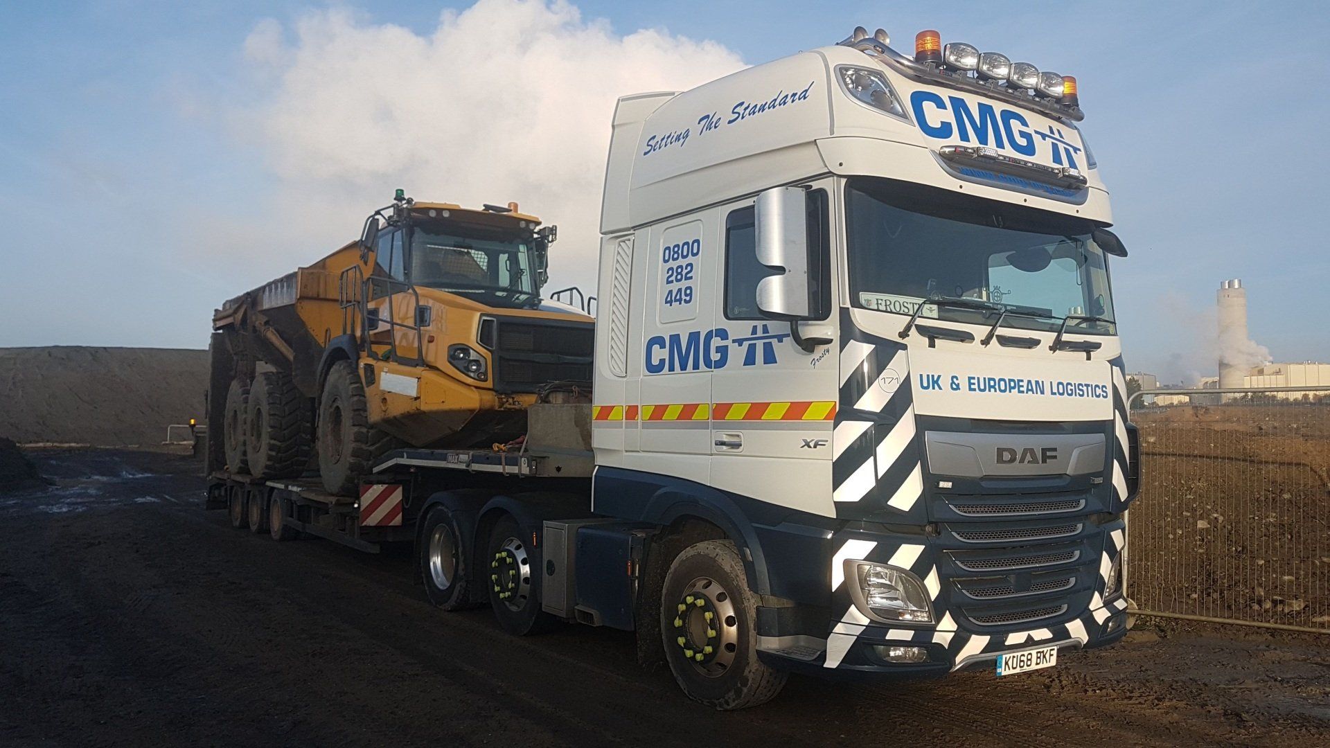 a truck that says cmg on the side of it
