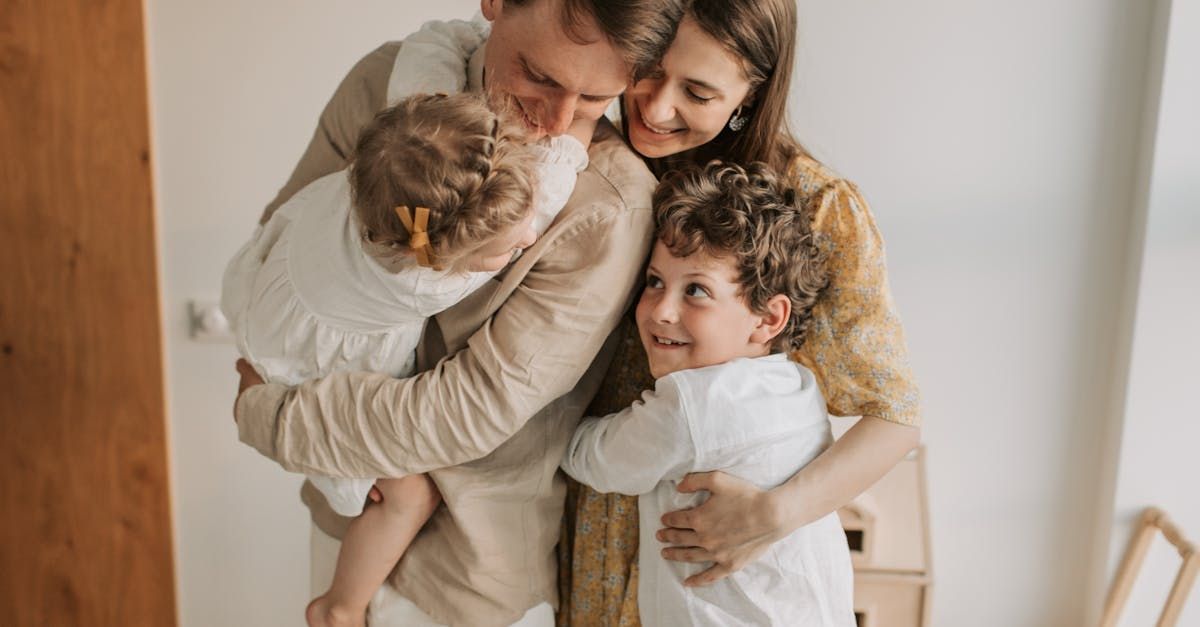 A family is posing for a picture together in a room.
