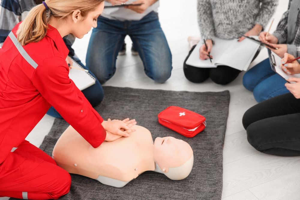 CPR Training Scene With a Person Practising Chest Compressions — Safe Industries Group in Mid North Coast, NSW