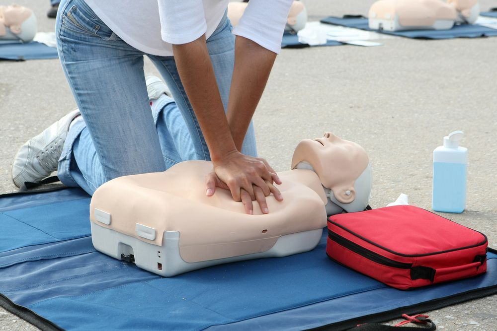 Person Wrapping a Bandaged Hand With a White Elastic Bandage — Safe Industries Group in Woodrising, NSW