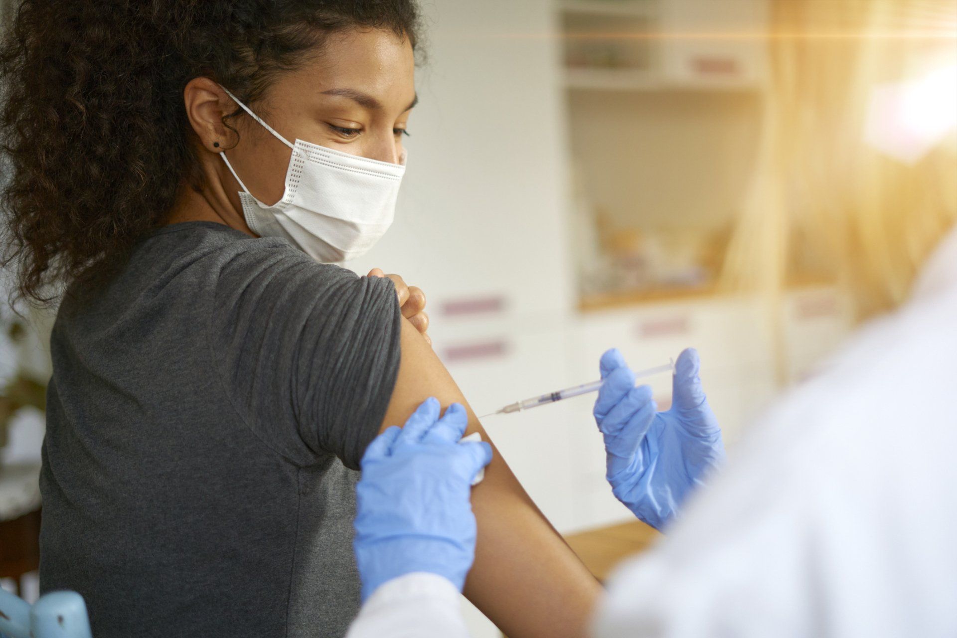 Young Woman Getting Flu-Shot — St. Marys, GA — Coastal Wellness Family Medicine