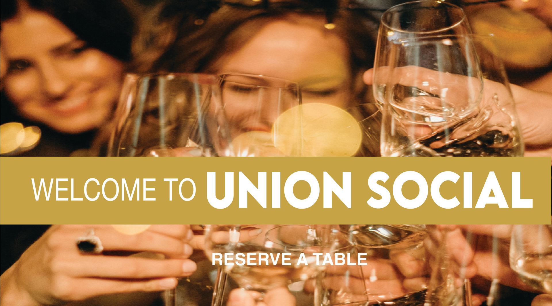 A group of people are toasting with wine glasses.
