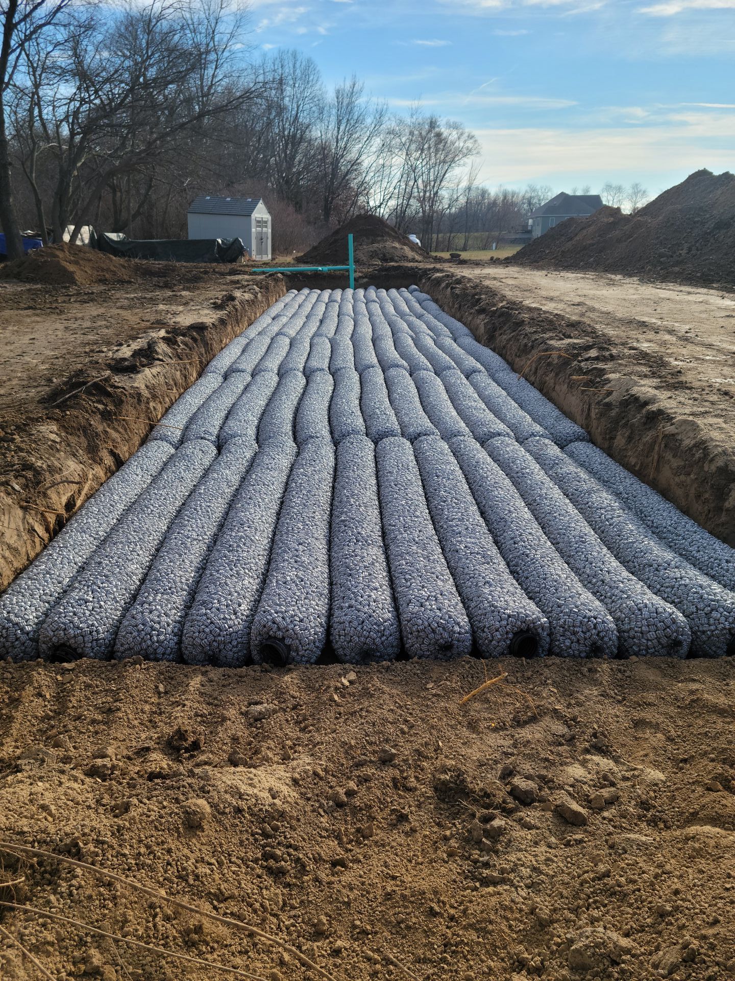 three concrete septic tanks are sitting in a trench