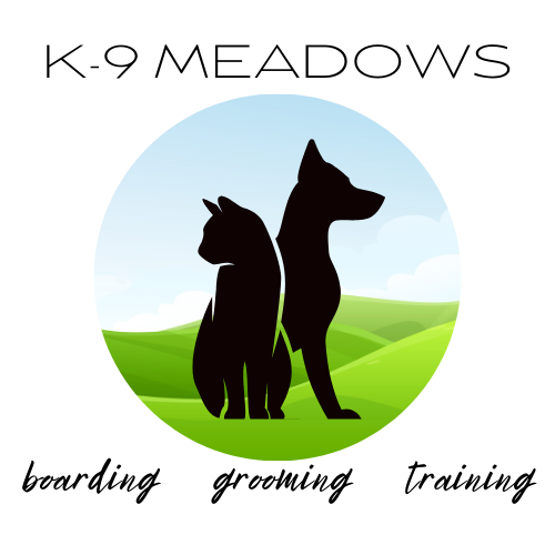 Logo: black silhouettes of a dog and cat, green grassy hills, blue sky, and text 