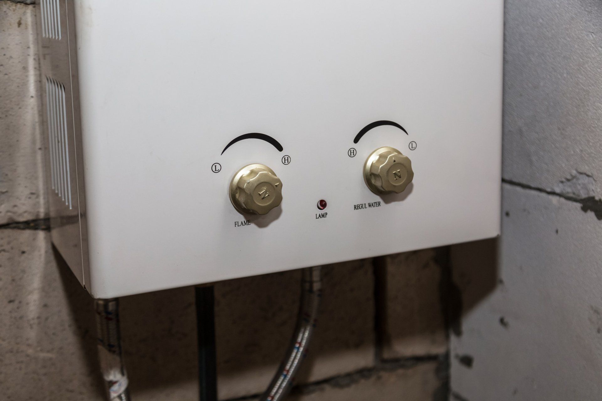 Gas water heater installed in a technical room.