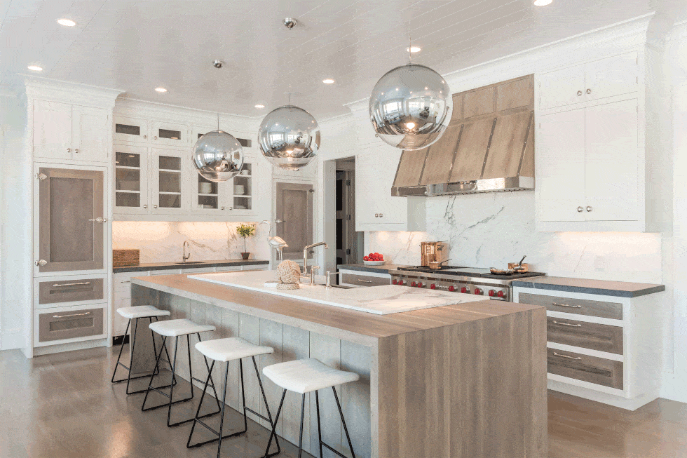 There is a large island in the middle of the kitchen.