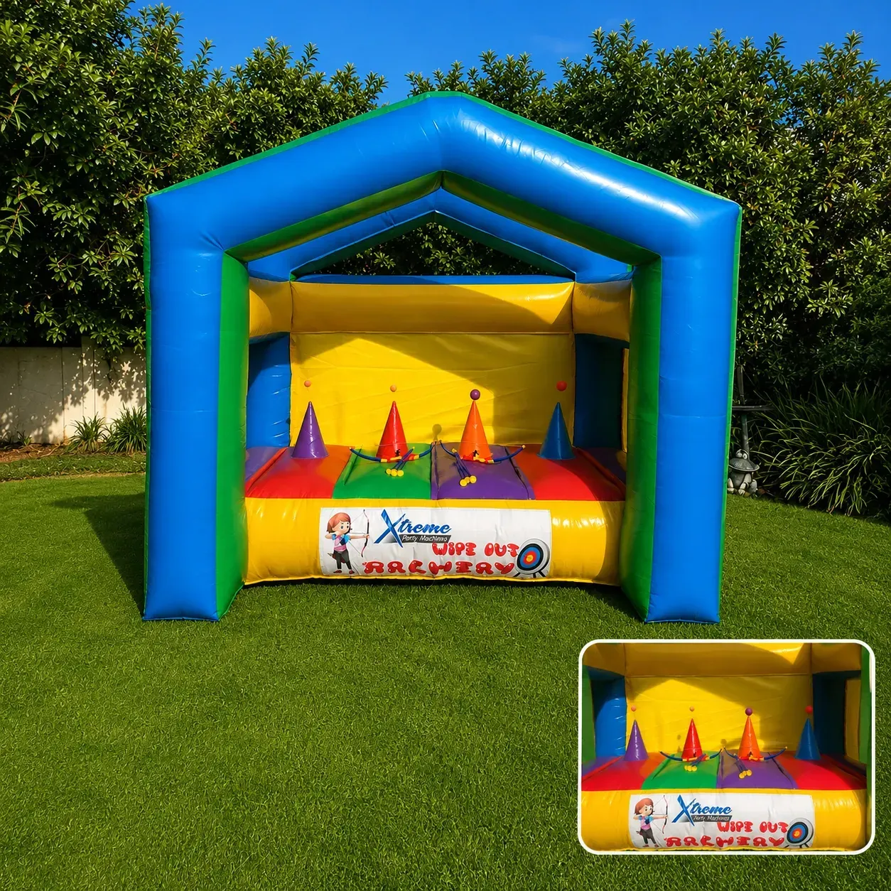 Two participants competing at an inflatable archery range