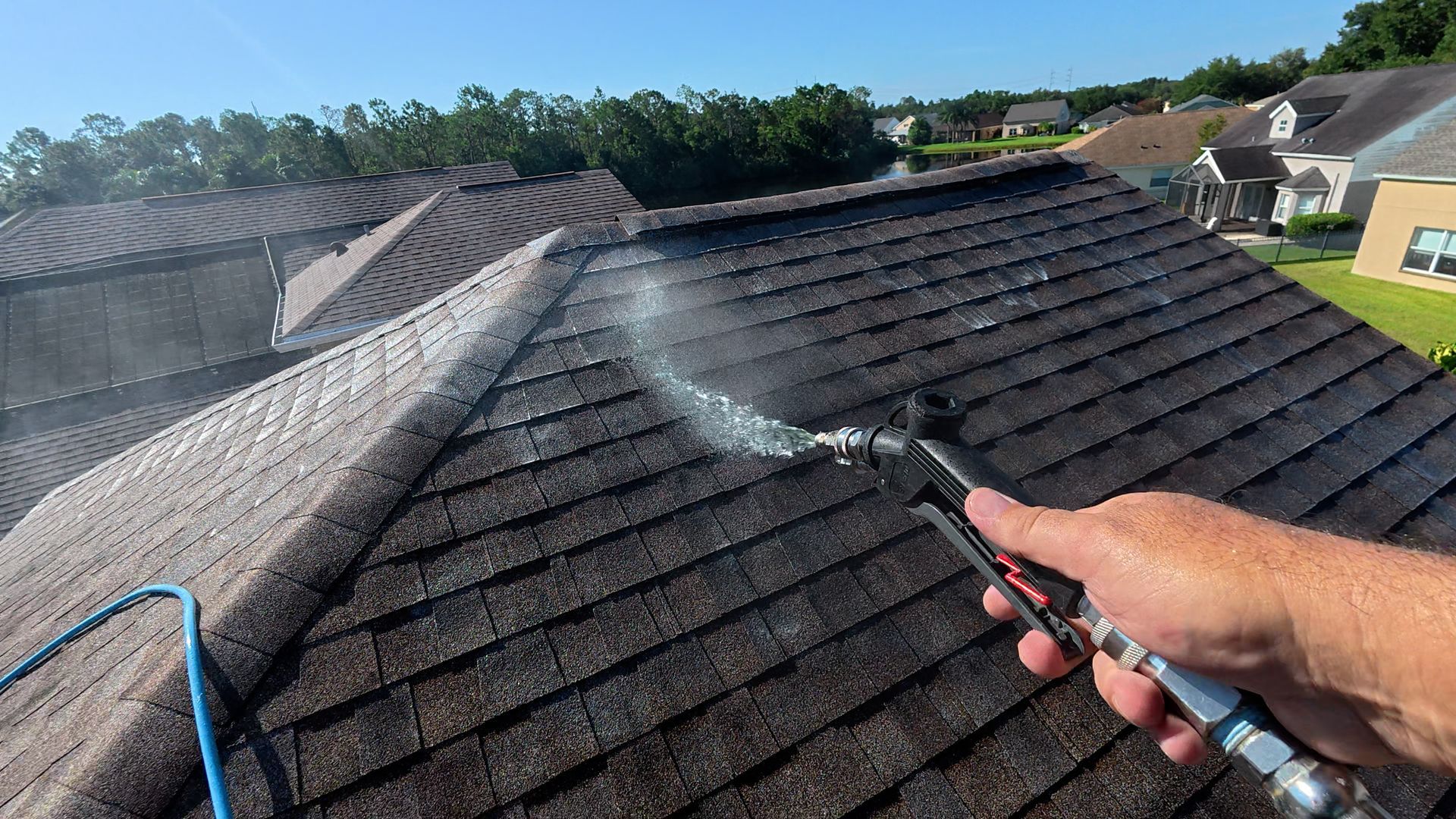 Soft washing a shingle roof
