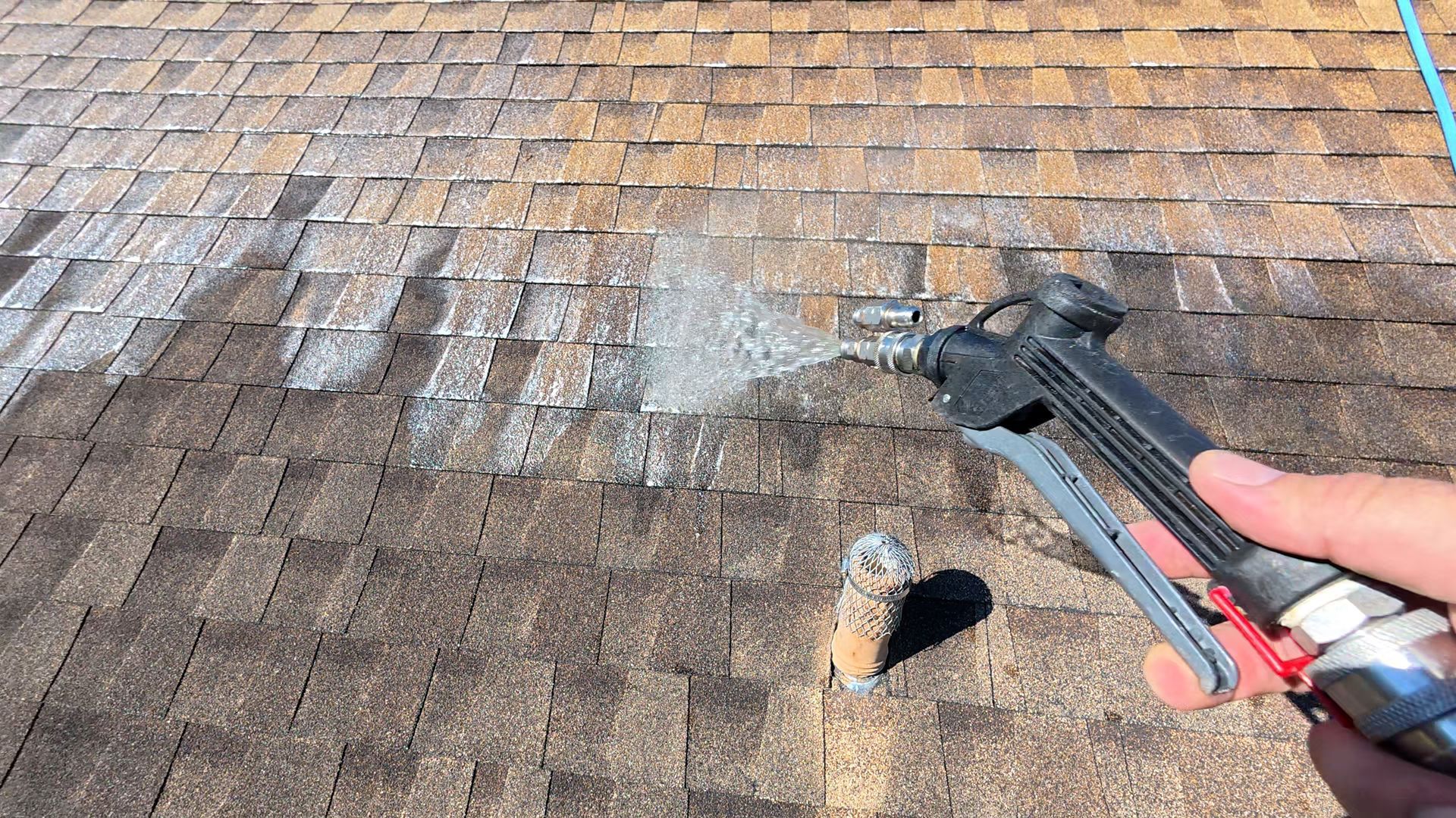 Soft washing a shingle roof