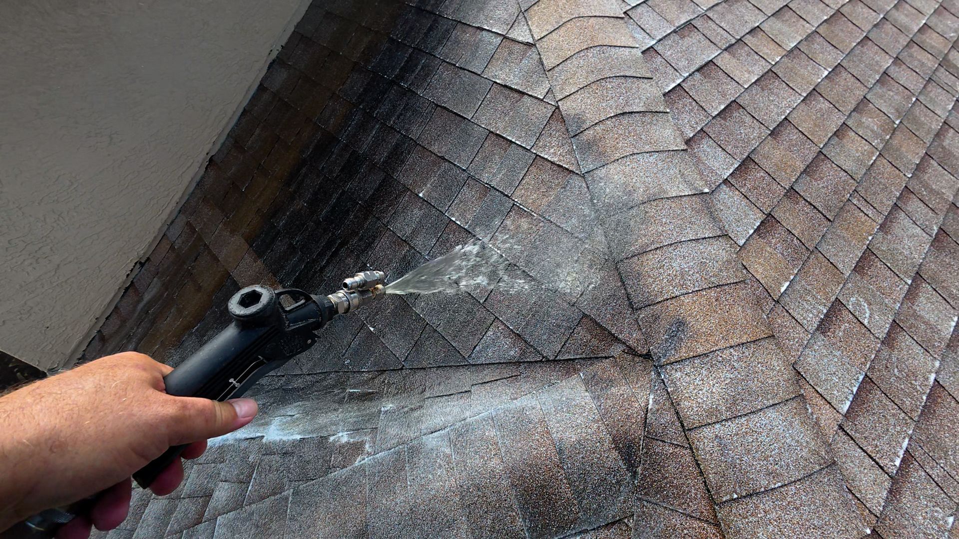 Soft washing a shingle roof