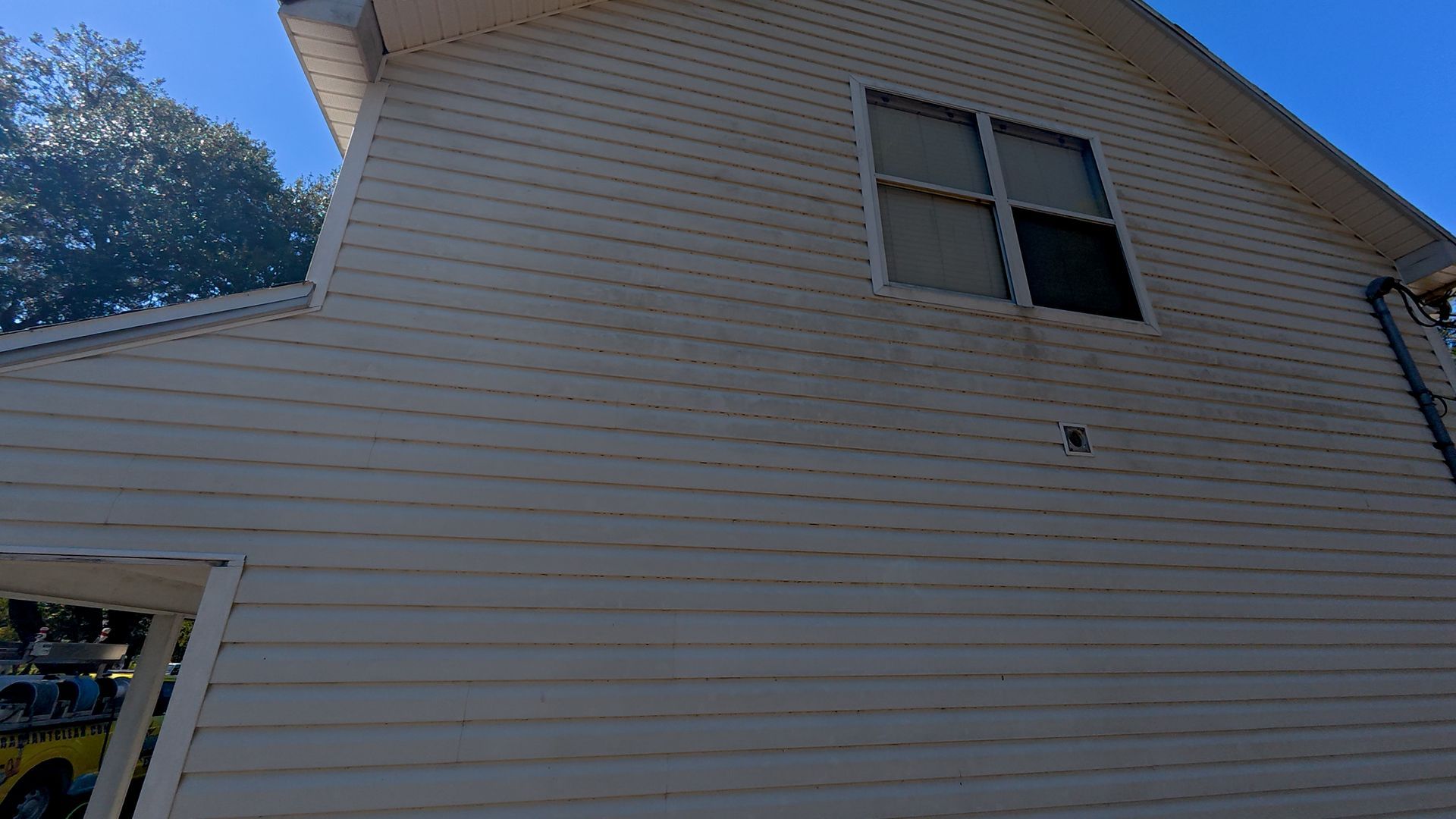 Vinyl siding soft washing