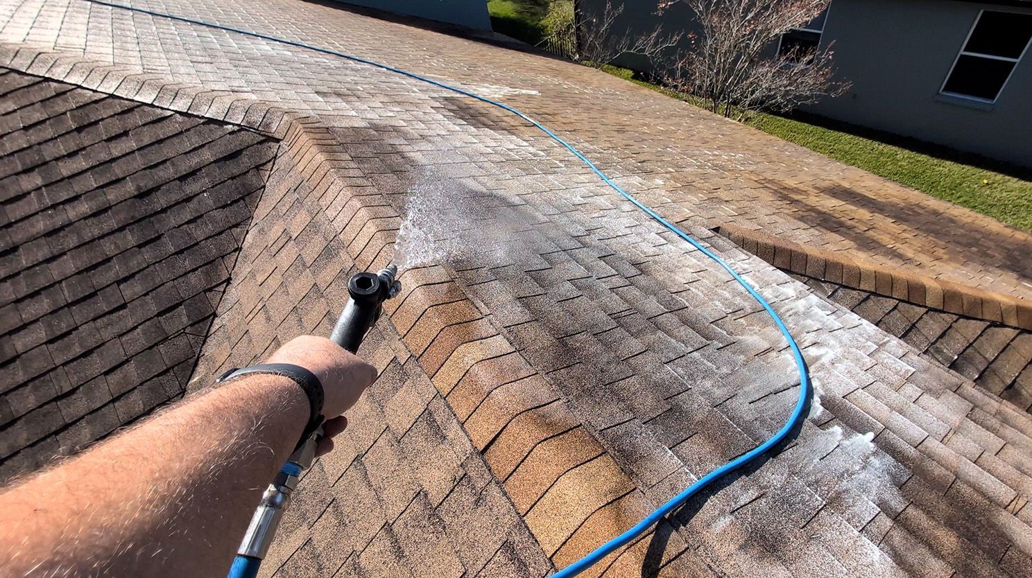 Person washing roof