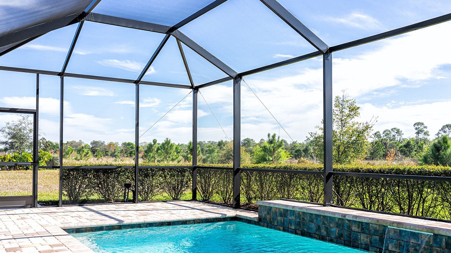 Pressure washing screen enclosures