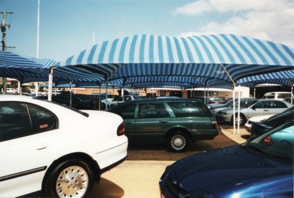 Large Umbrella in Car Parking — Capalaba, Qld — M & M Tarp Repairs