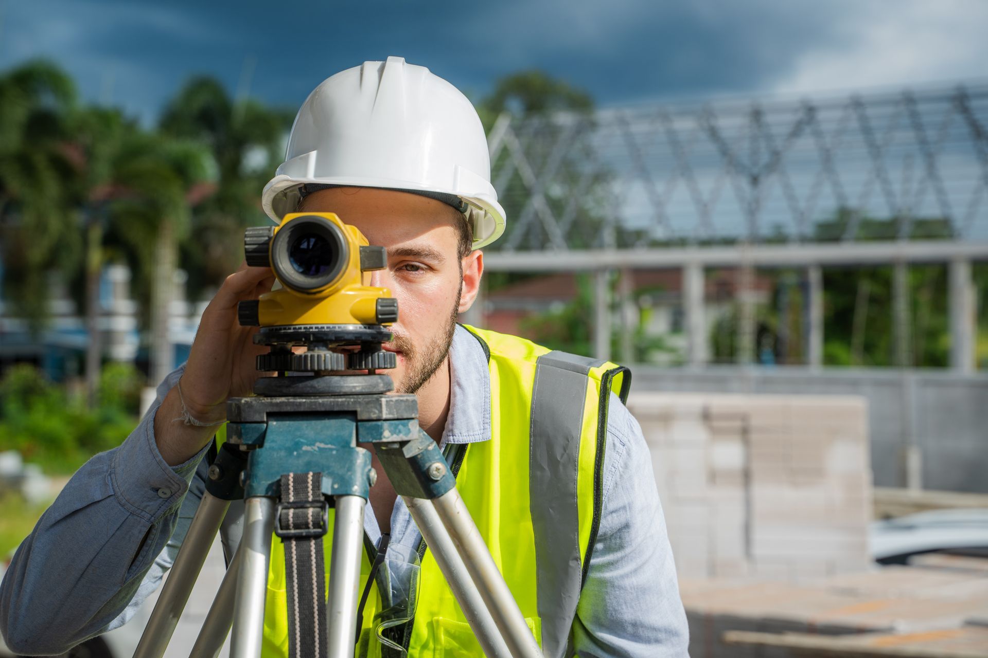 Worker Is Looking Through Surveying Equipment — Clarkston, MI — Kieft Engineering