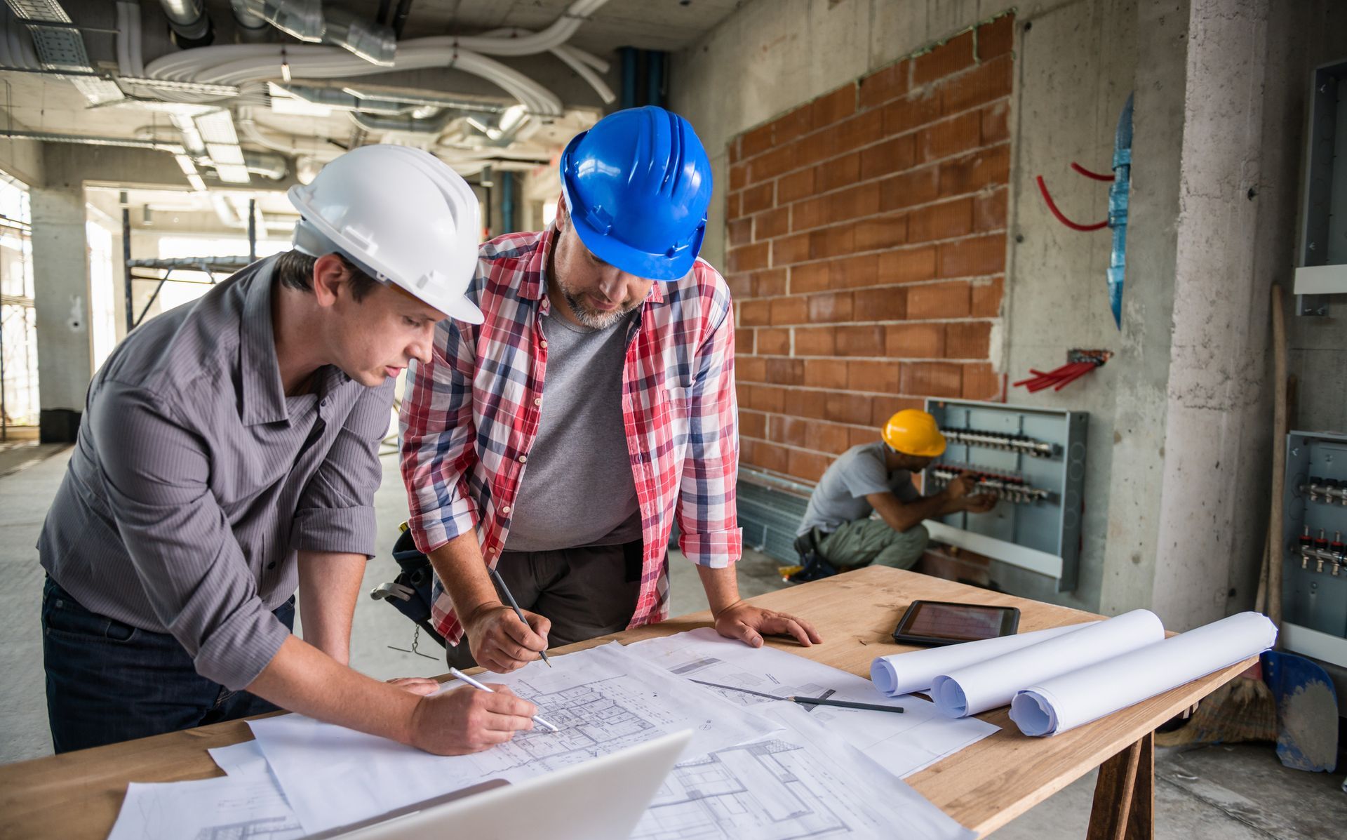 Engineers Looking at Blueprint — Clarkston, MI — Kieft Engineering