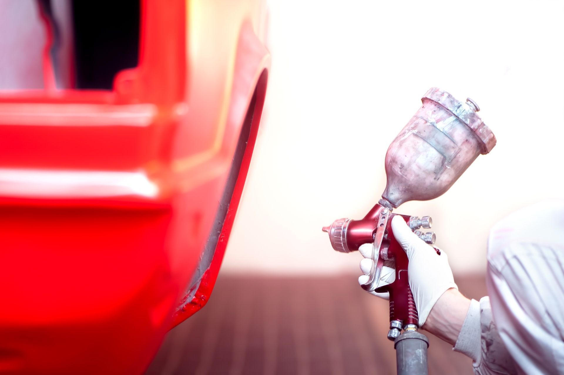 Painting red color a sidings of a car
