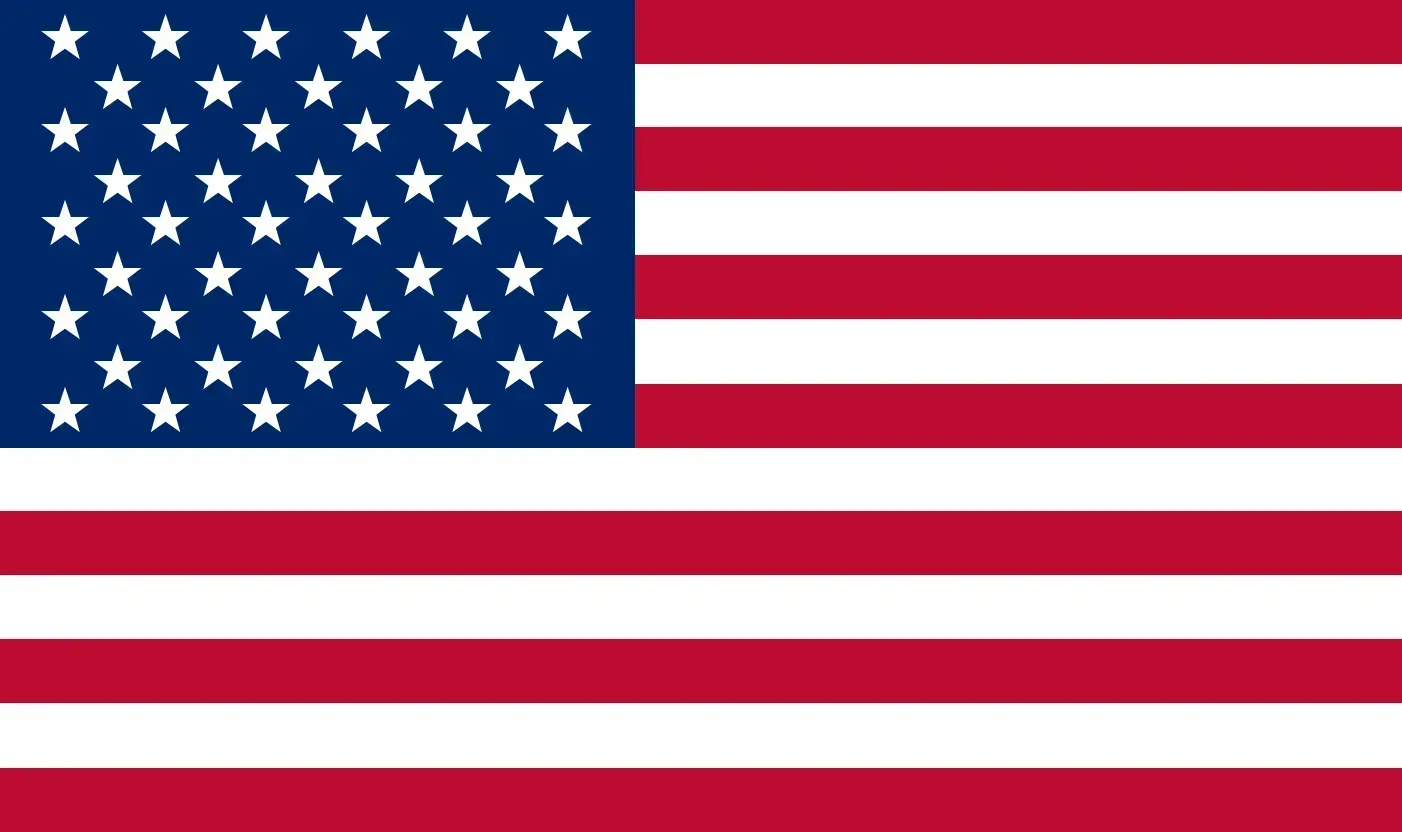 A red flag with a white flower and stars on it