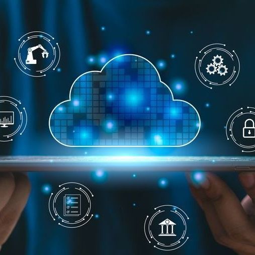 Hands holding a tablet displaying a cloud computing illustration with icons for security, automation, and data.