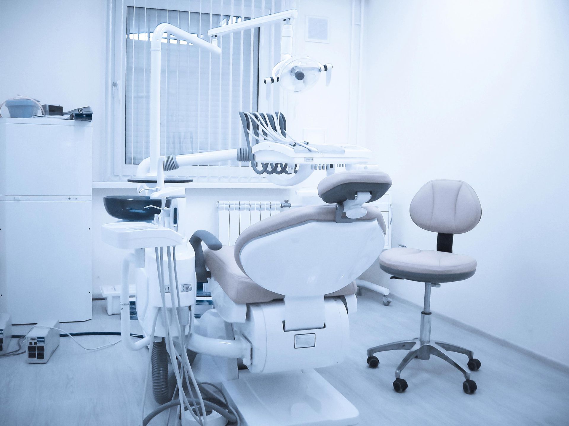 There is a dental chair in the dental office.