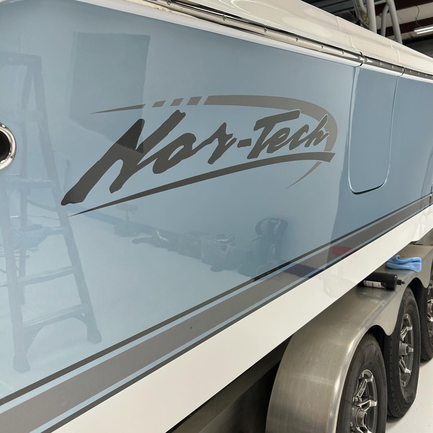 Gray boat hull with black “Nor-Tech” logo on a trailer