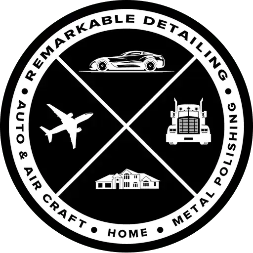 Black-and-white round logo for Remarkable Detailing with car, plane, truck, and home icons.