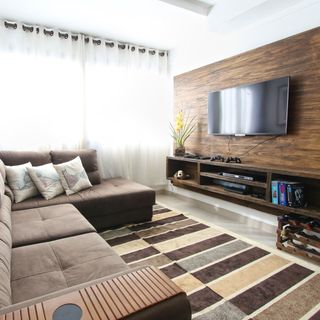 A living room with a couch and a flat screen tv