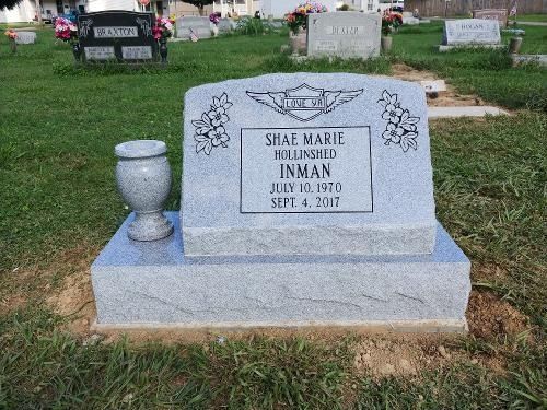 A light gray granite headstone for Shae Marie Inman, marked July 30, 1970 – Sept. 4, 2017, standing in a grassy cemetery.
