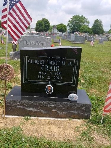 A black granite gravestone for Gilbert 