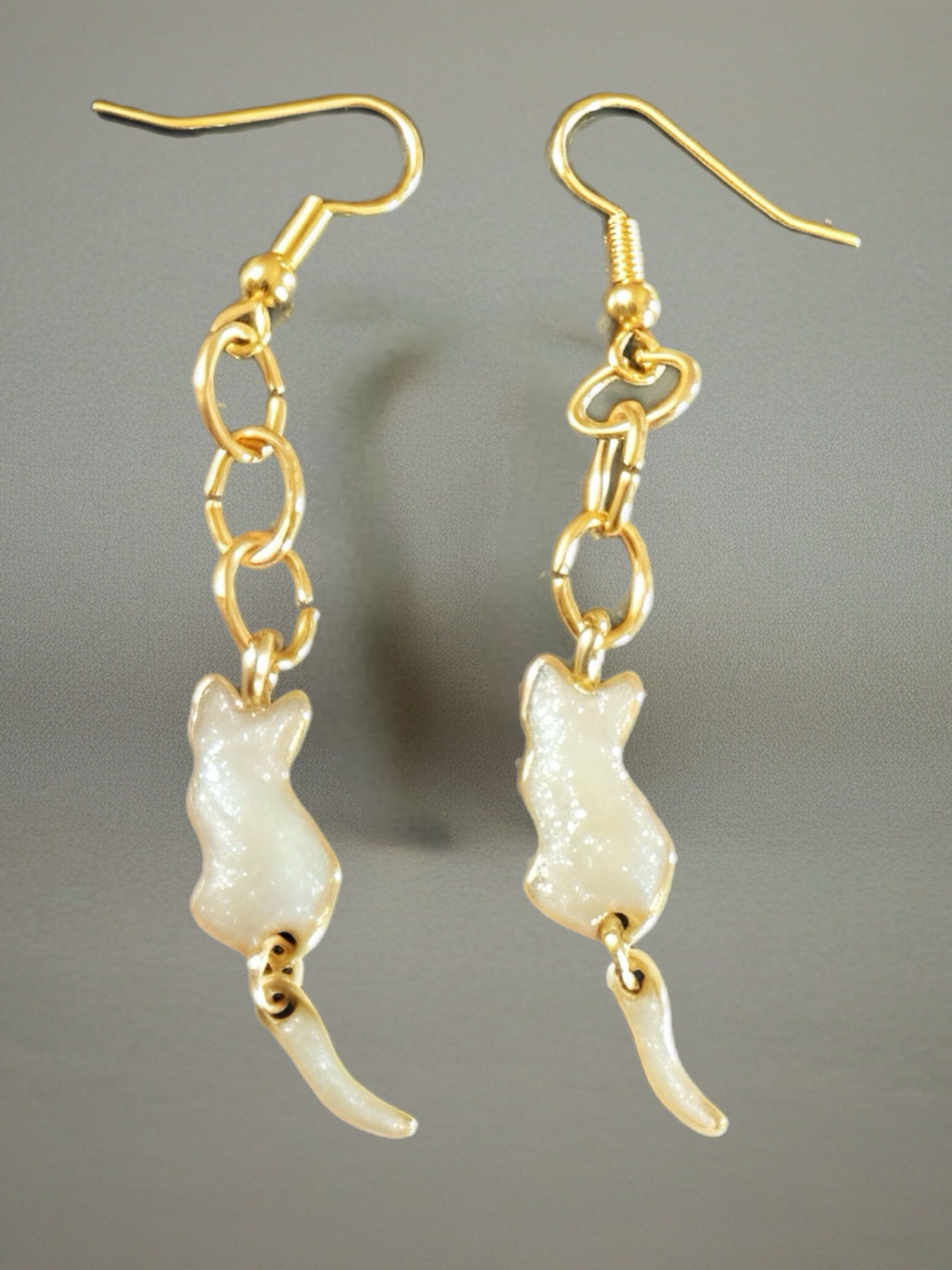 White cat dangly earrings