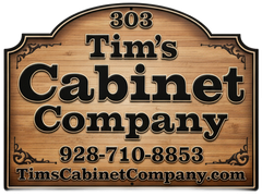 Wooden sign for Tim's Cabinet Company with logo, phone number, and website address.