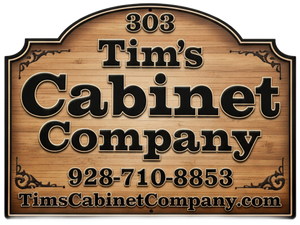 Wooden sign for Tim's Cabinet Company with logo, phone number, and website address.