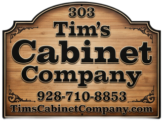 Wooden sign for Tim's Cabinet Company with logo, phone number, and website address.