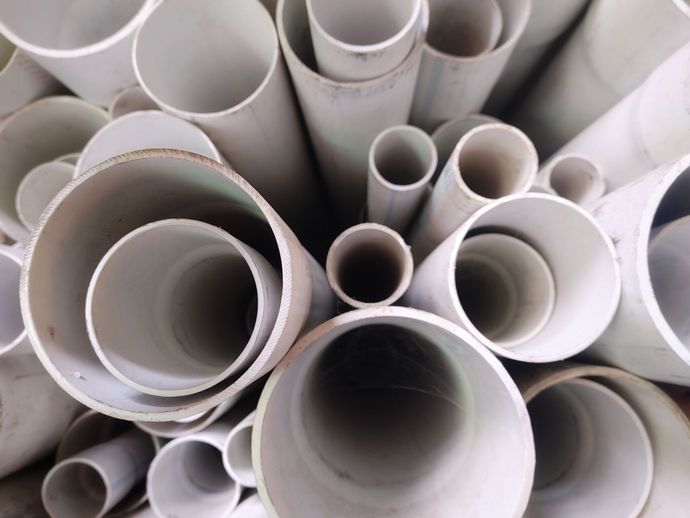 Stacked white PVC pipes viewed from above