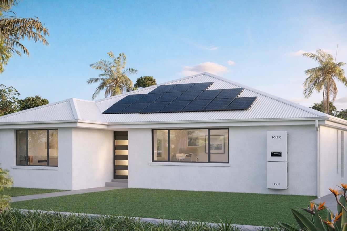 An aerial view of a building with Longi solar panels on its roof, and solax brand battery and inverter
