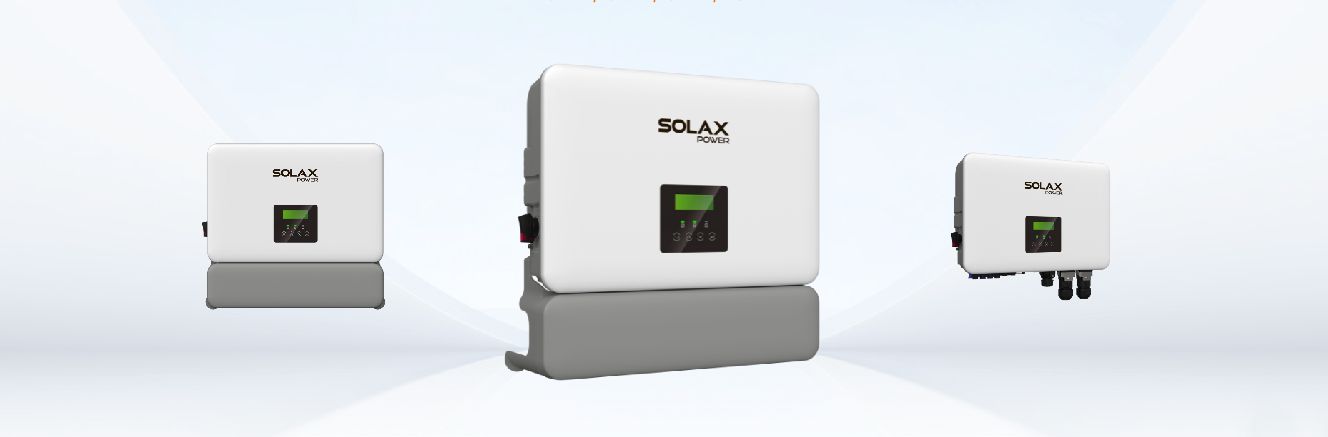 Three white solar inverters on gray bases against a light blue background.