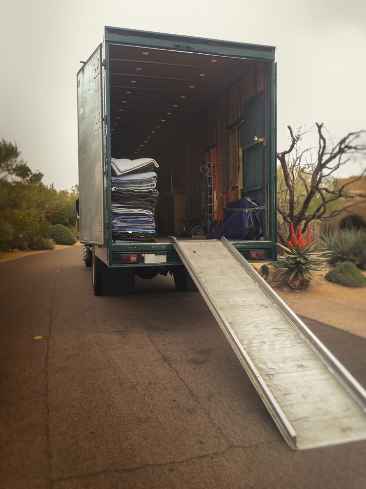 A Moving Truck with A Ramp Attached to It — Town & Country Removals In Laurieton, NSW