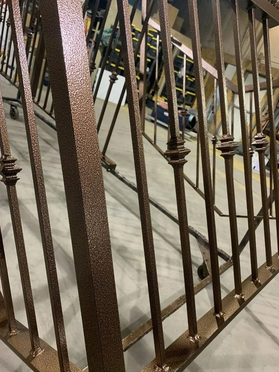 Bronze metal railing with decorative accents.