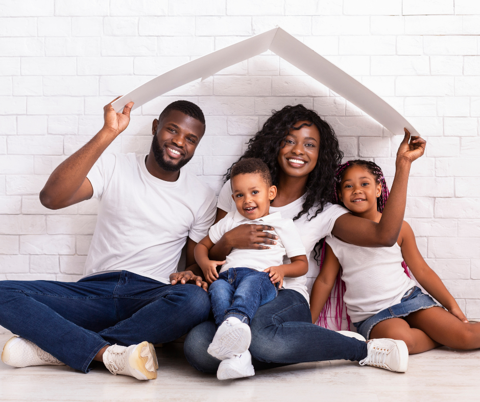 Family under paper roof