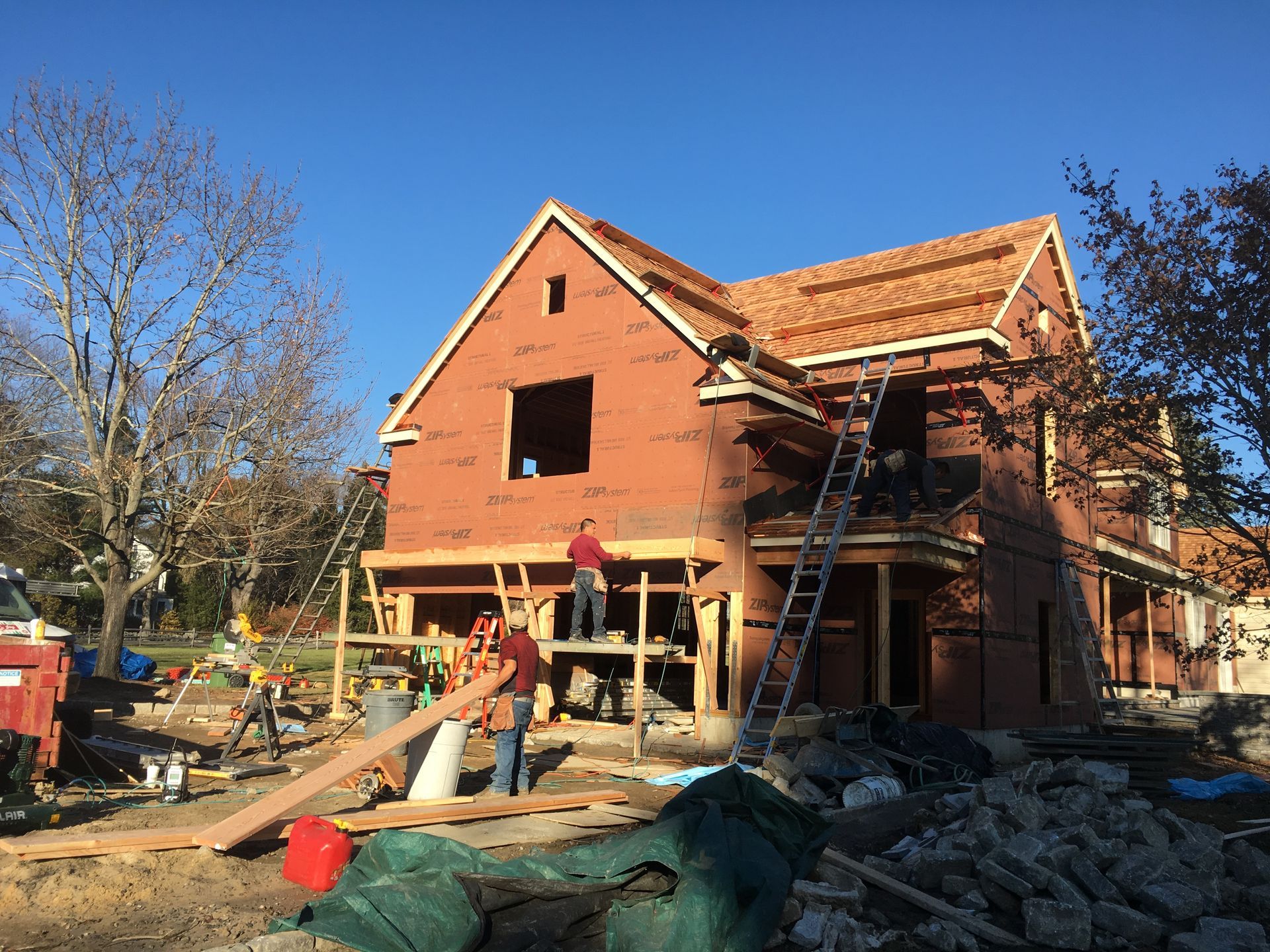 New home being built with newly installed cedar roof