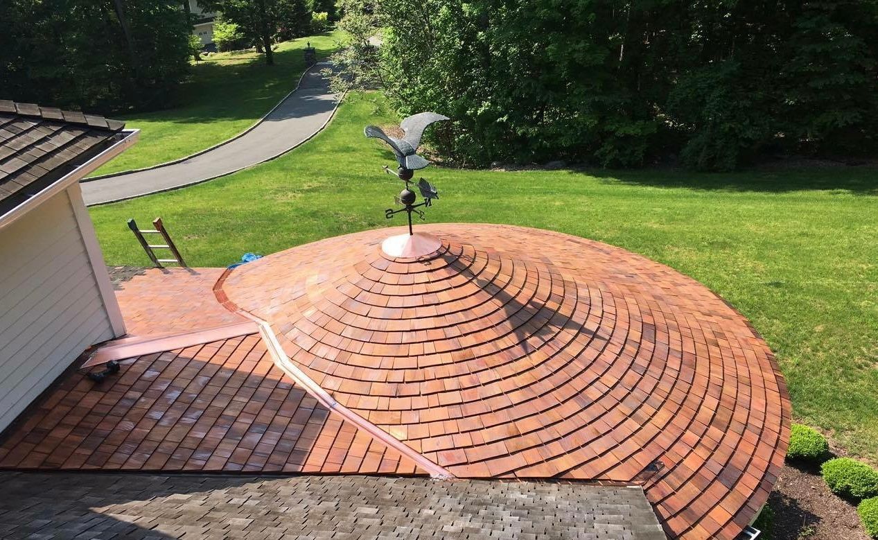 Side view of a cedar roof installation