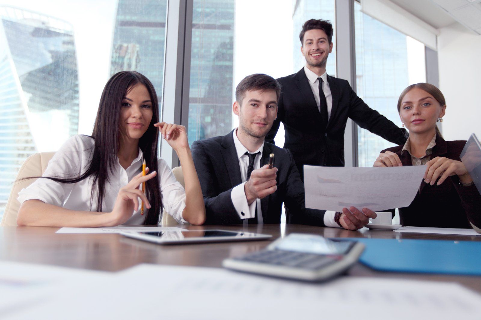 four people inside the office