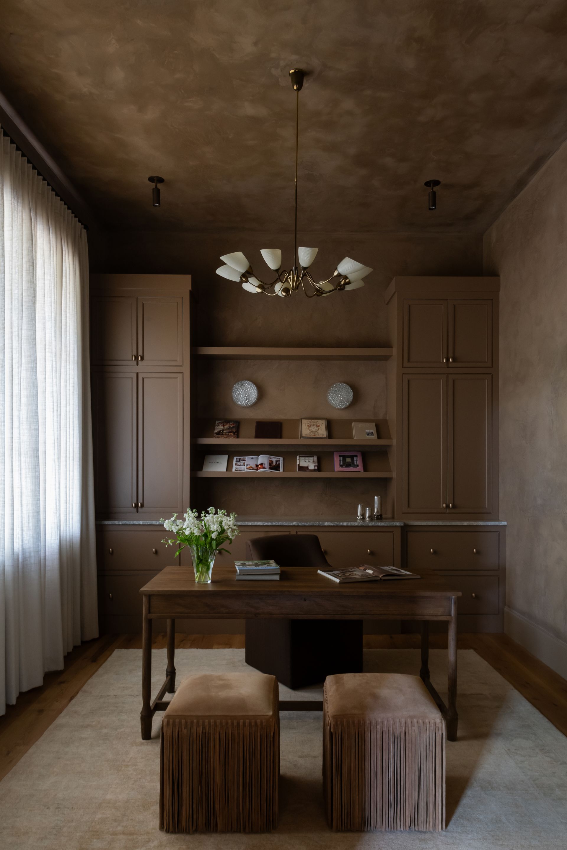 luxury interior designer in franklin, tn. featuring a custom office cabinetry with plaster walls and vintage lighting