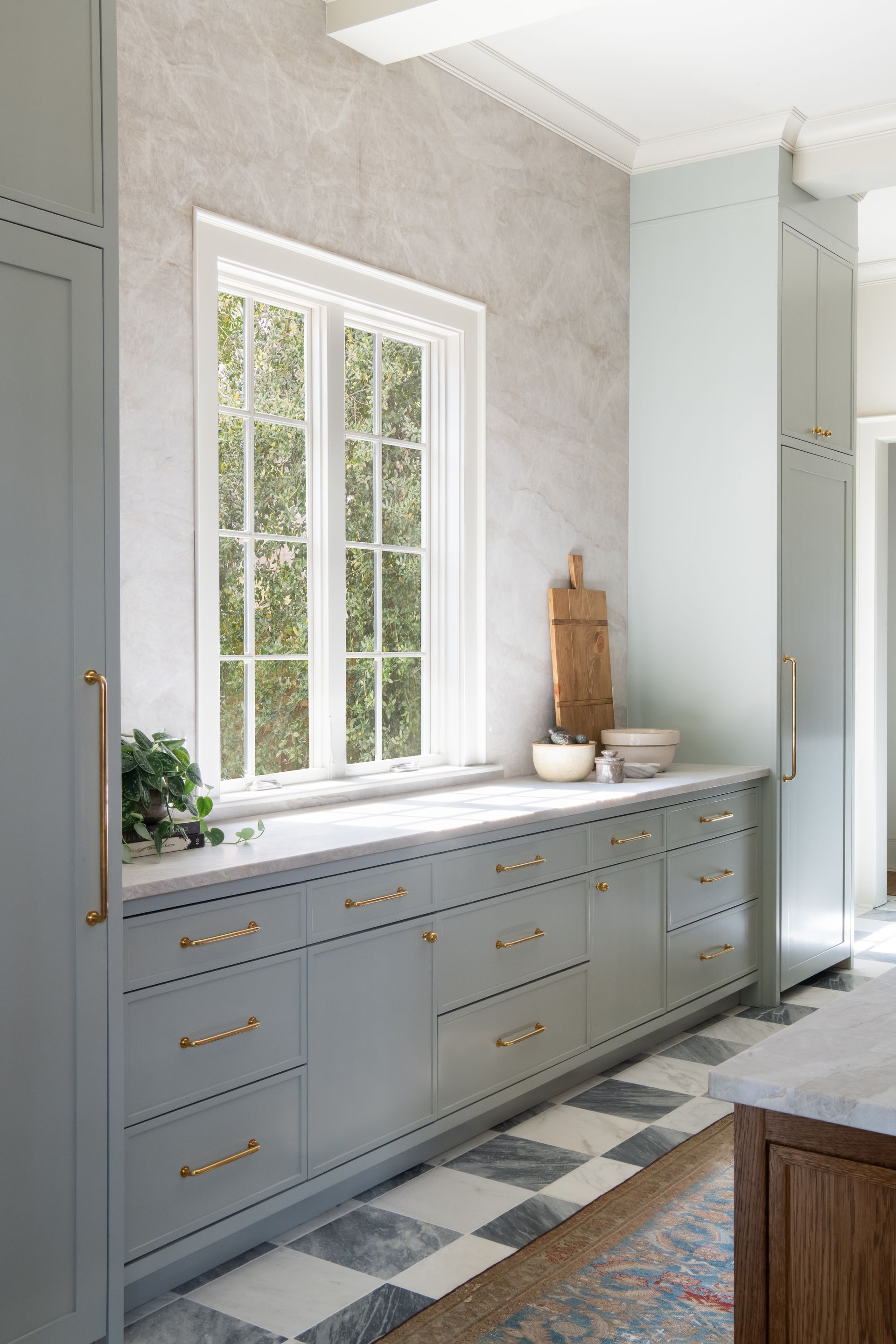 Luxury European inspired kitchen designed by nashville interior designer featuring taj mahal quartzite and white oak cabinets