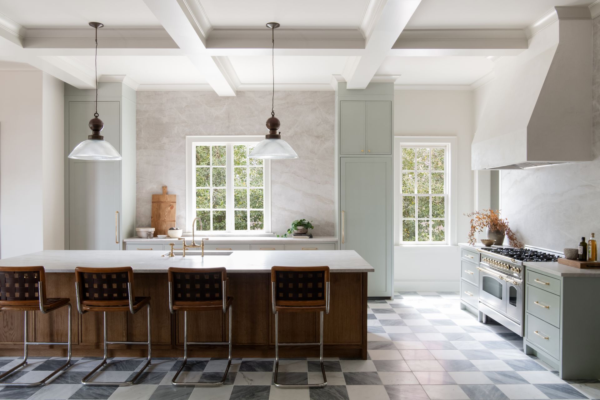 Luxury European inspired kitchen designed by nashville interior designer featuring taj mahal quartzite and white oak cabinets