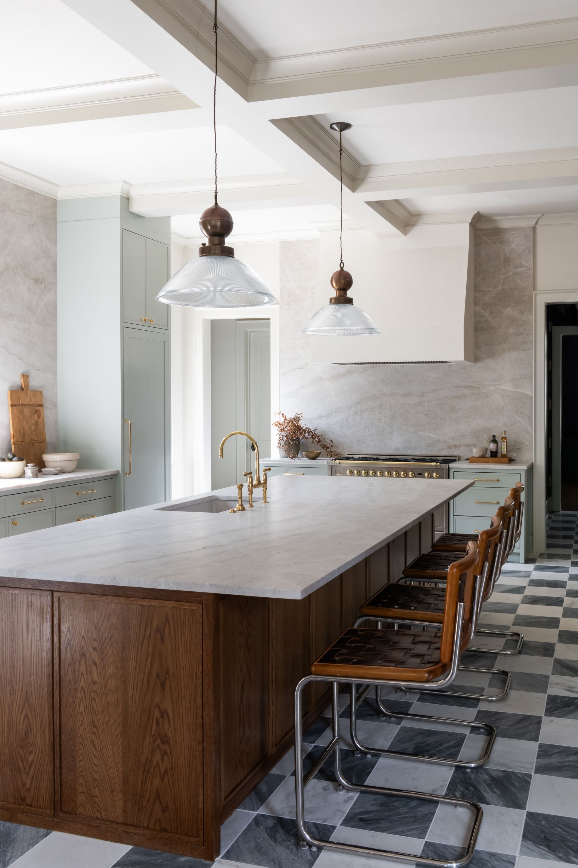 Luxury European inspired kitchen designed by nashville interior designer featuring taj mahal quartzite and white oak cabinets