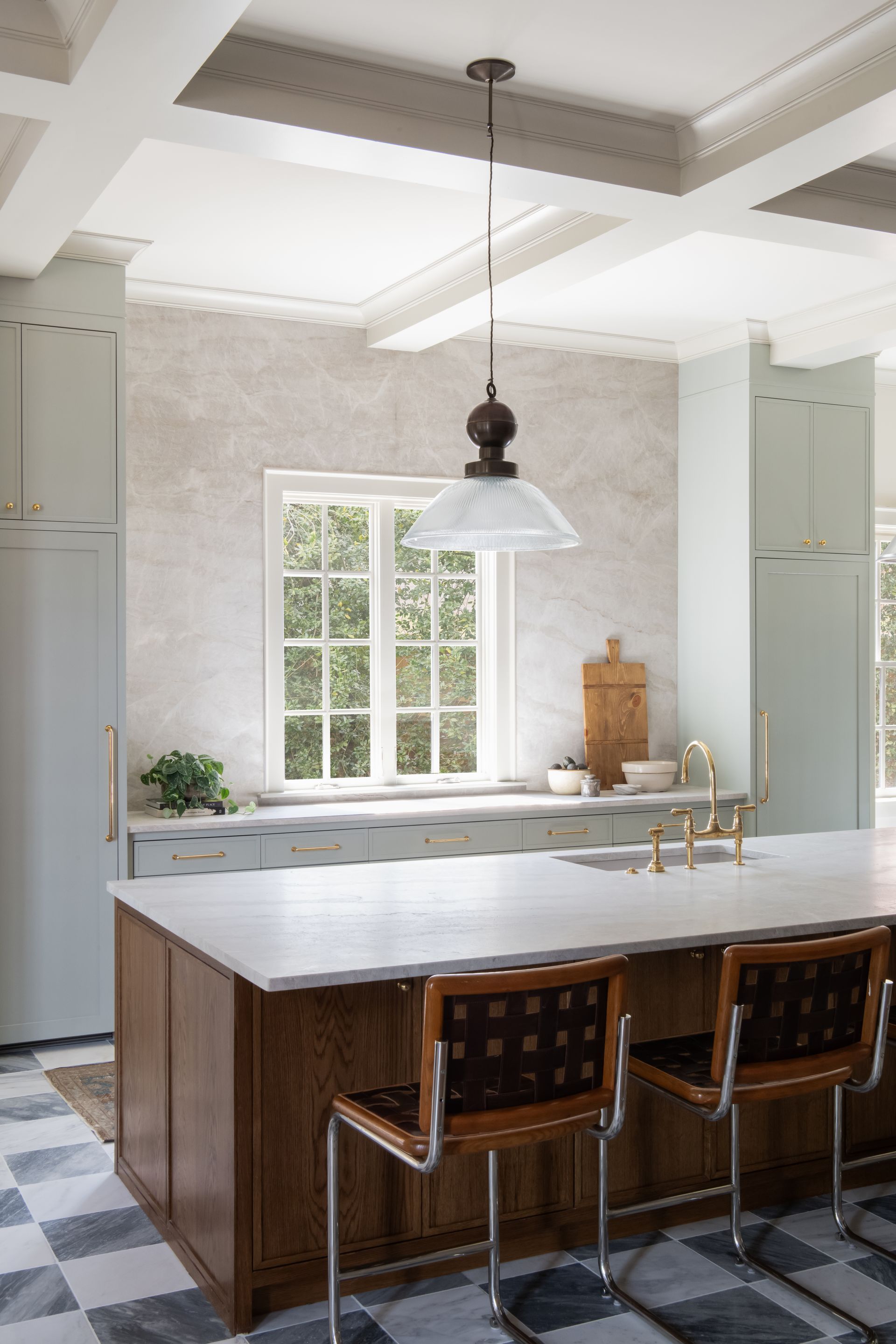 Luxury European inspired kitchen designed by nashville interior designer featuring taj mahal quartzite and white oak cabinets