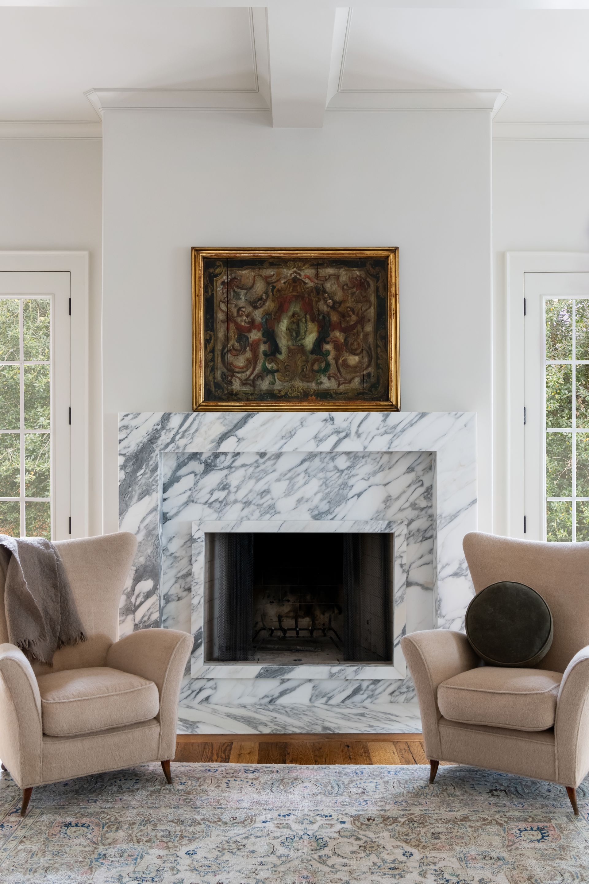 Luxury European inspired kitchen designed by nashville interior designer featuring taj mahal quartzite and white oak cabinets